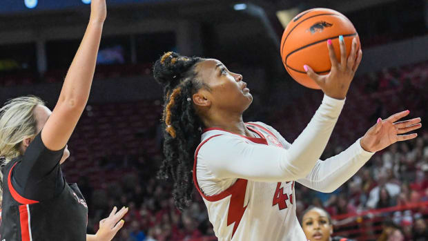 Razorbacks' Makayla Daniels puts up a shot inside against Texas Tech in the WNIT on Friday night.